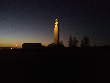 the same monument but view sideways with a light glowing onto it